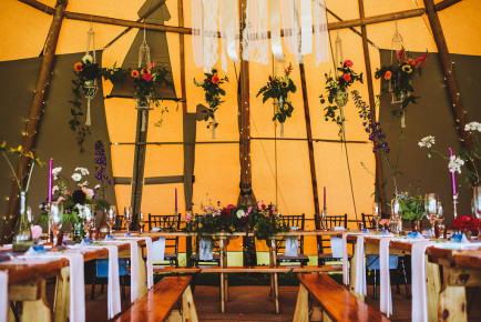 Bohemian tipi wedding styling with wild and natural flowers