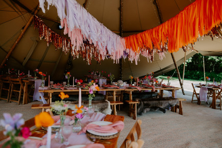 Bright and colourful flowers for a tipi party wedding