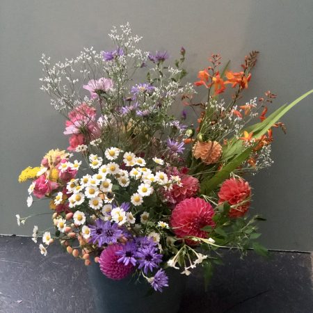 DIY wedding flower bucket of bright July flowers
