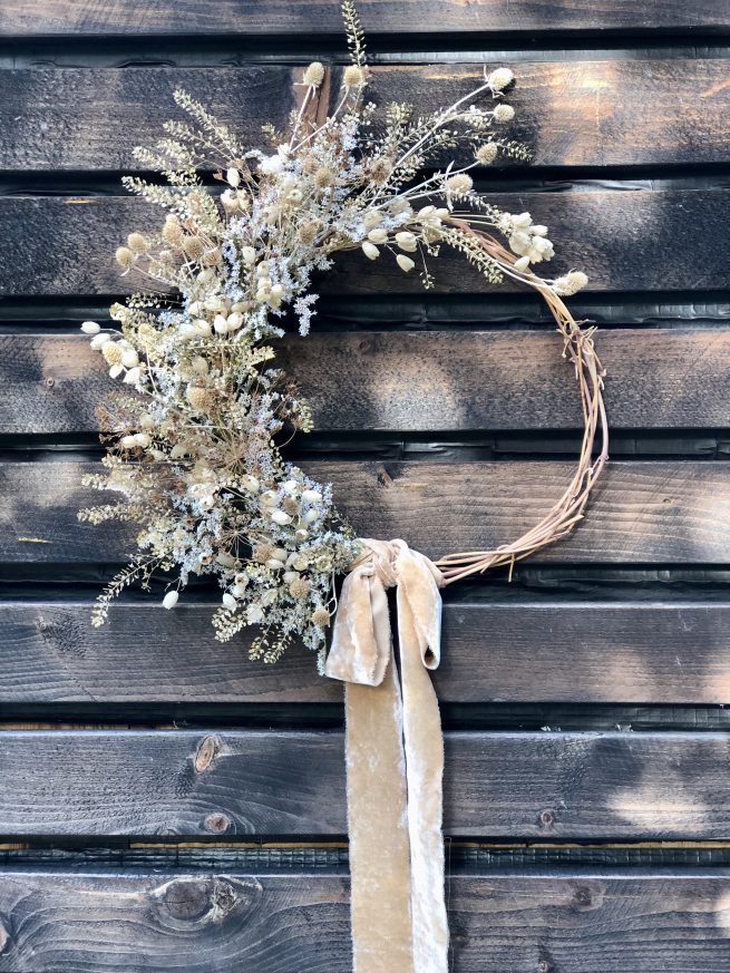 dried flower wreath half moon with neutral flowers