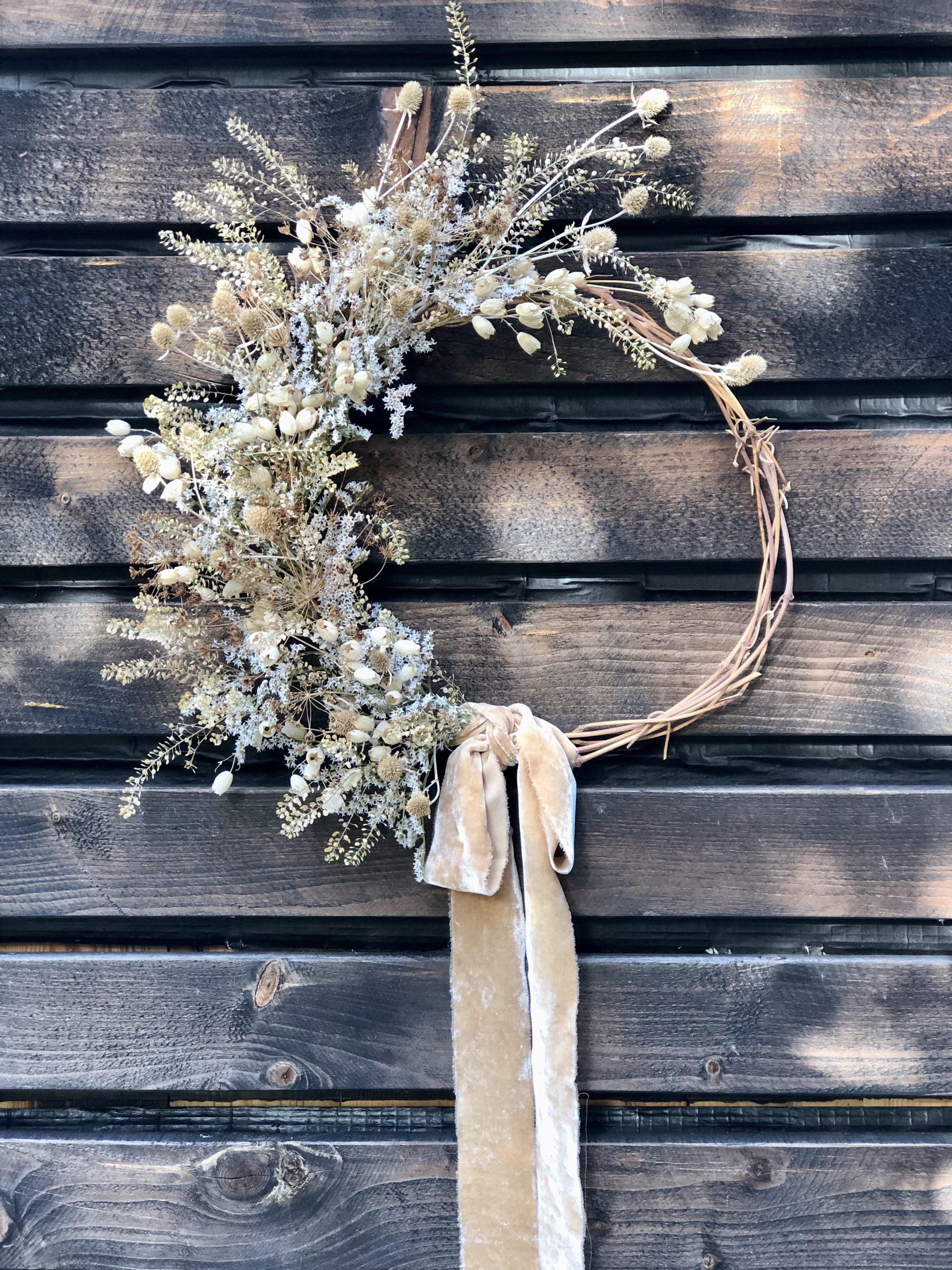 dried flower wreath half moon with neutral flowers